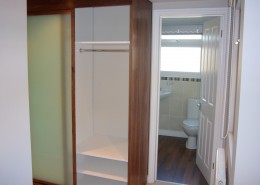 walnut wardrobe with glass sliding doors