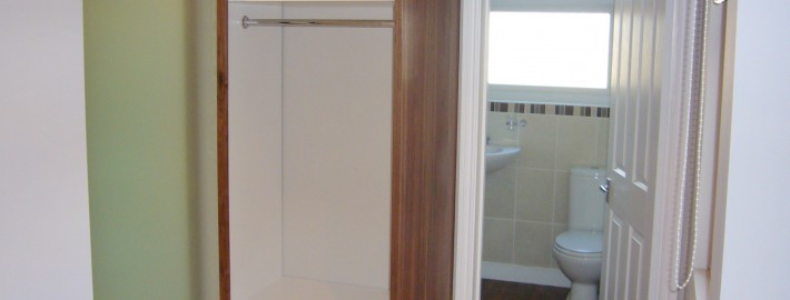 walnut wardrobe with glass sliding doors